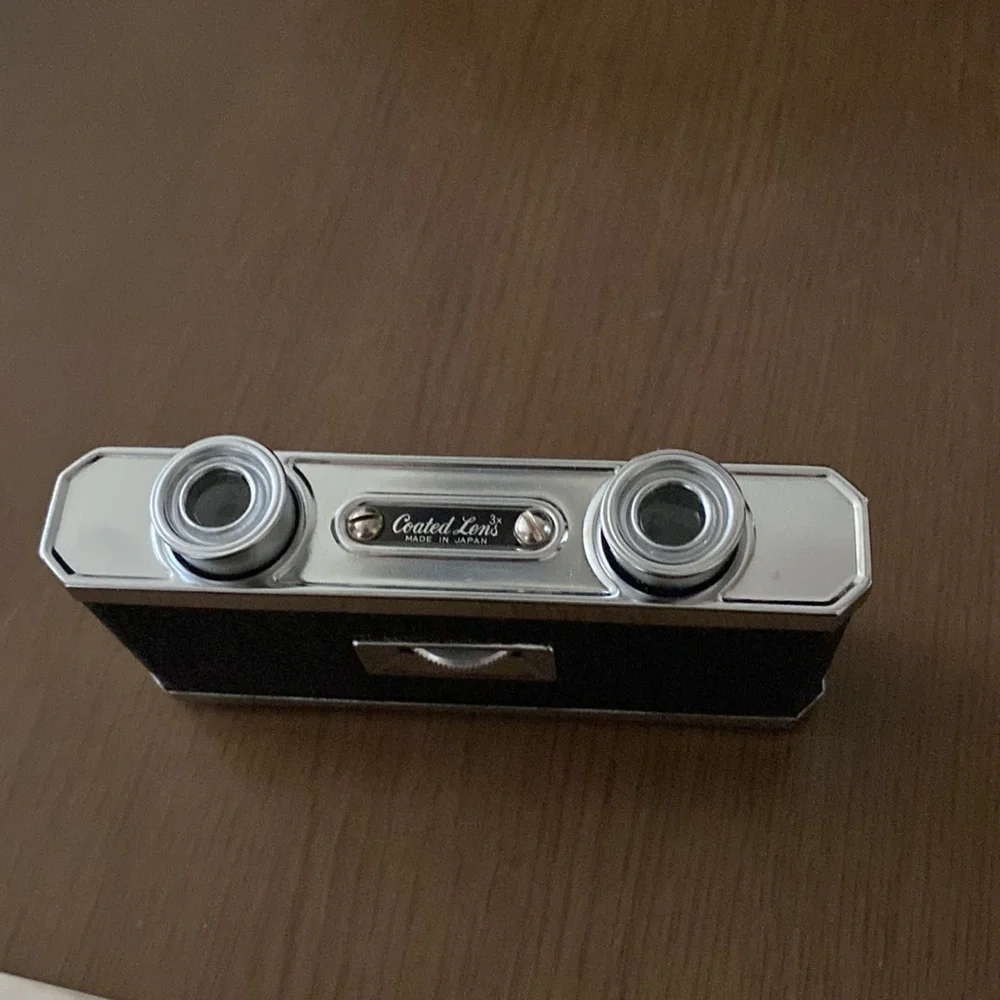 Antique binoculars in silver and black